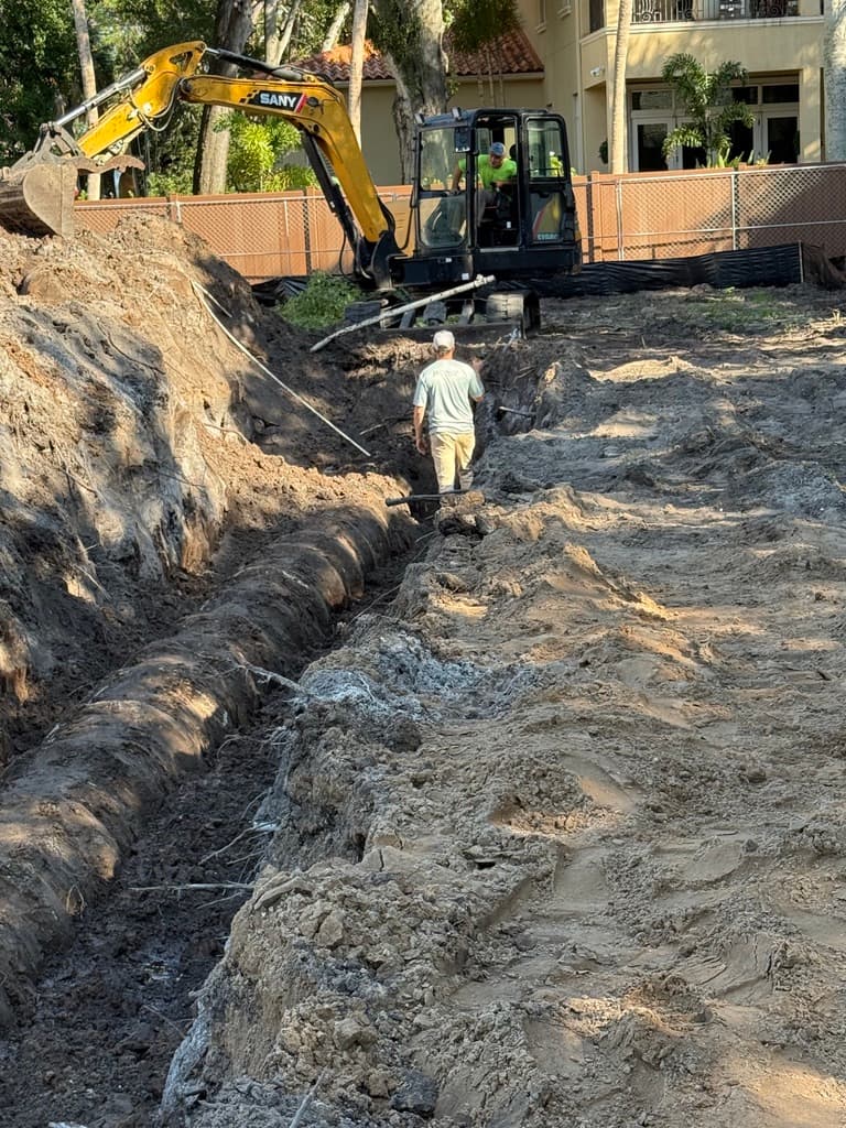 Excavator working in dirt for site development and property preparation